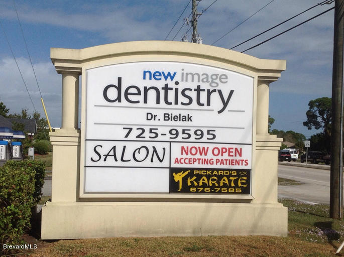 5132 Minton Road, Unit 6 Palm Bay, FL 32907 - Photo 2 of 15 a sign that is on the side of a building