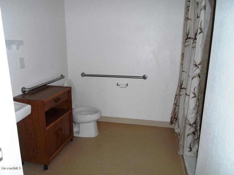 5132 Minton Road, Unit 6 Palm Bay, FL 32907 - Photo 4 of 15 a bathroom with a toilet and a shower