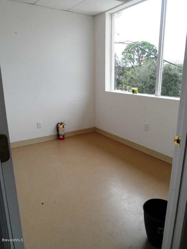 5132 Minton Road, Unit 6 Palm Bay, FL 32907 - Photo 7 of 15 an empty room with a chair