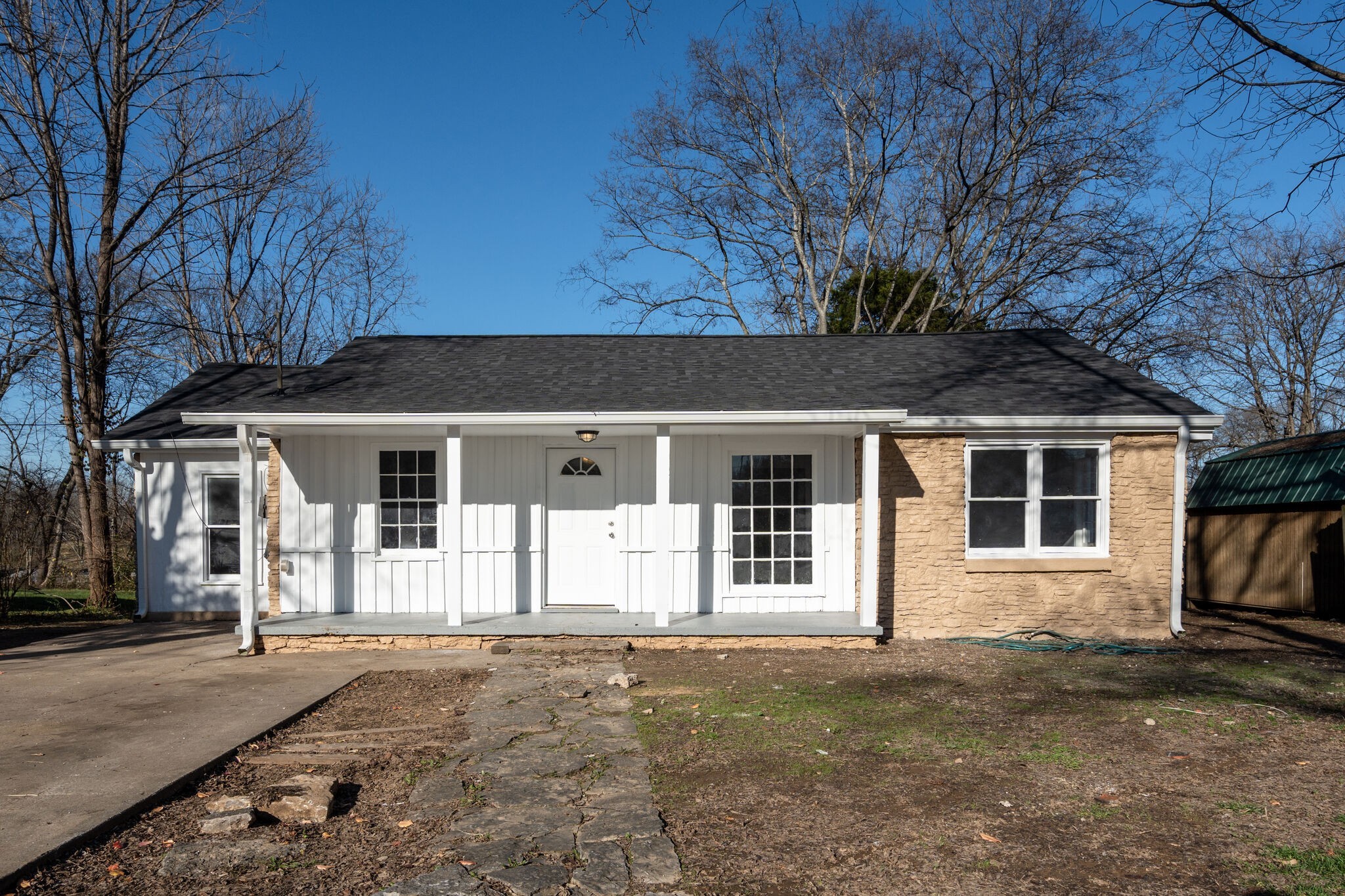 706 Pace Street Gallatin, TN 37066 - Photo 1 of 20 a front view of a house with a yard and garage