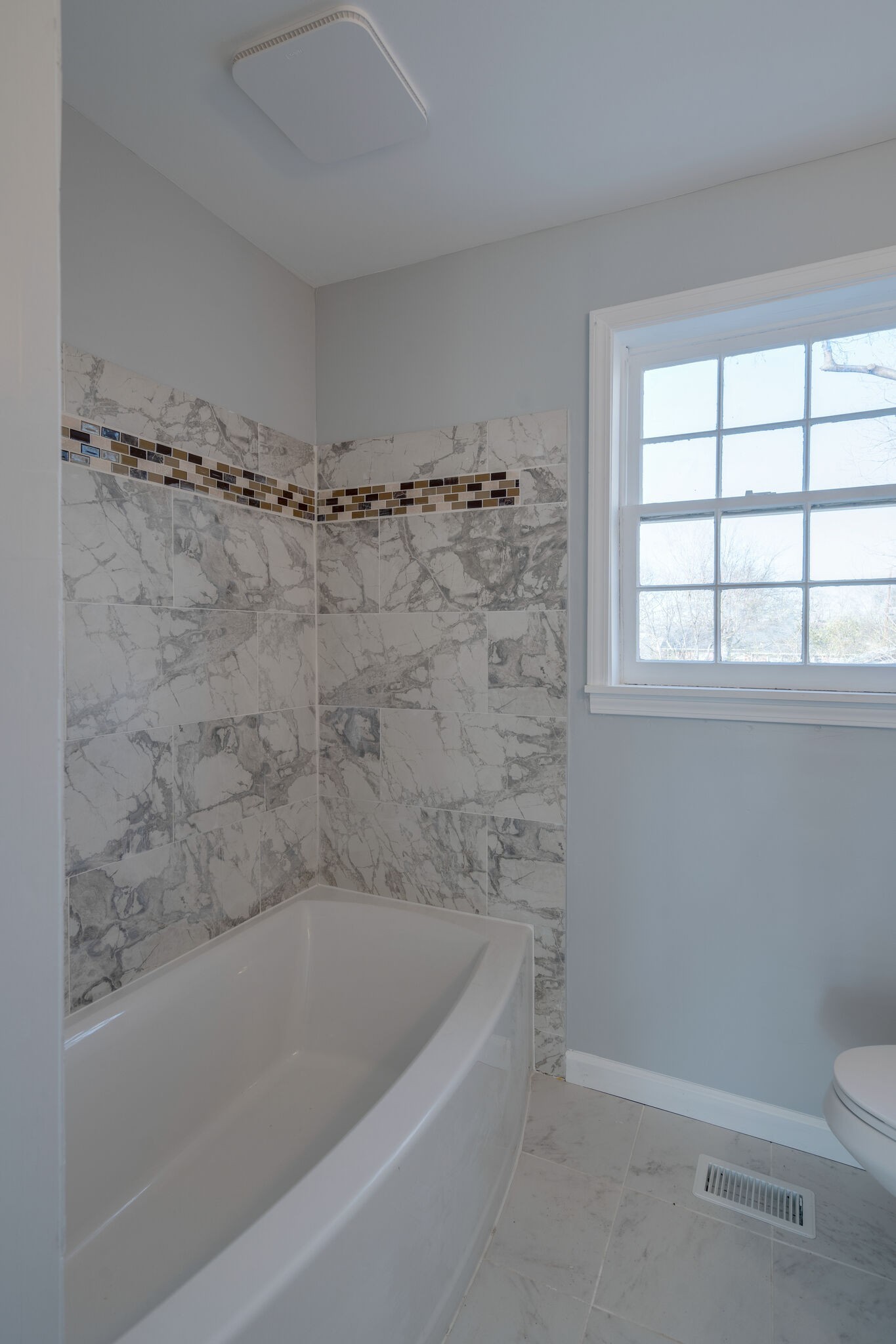 706 Pace Street Gallatin, TN 37066 - Photo 11 of 20 a bath tub sitting next to a toilet