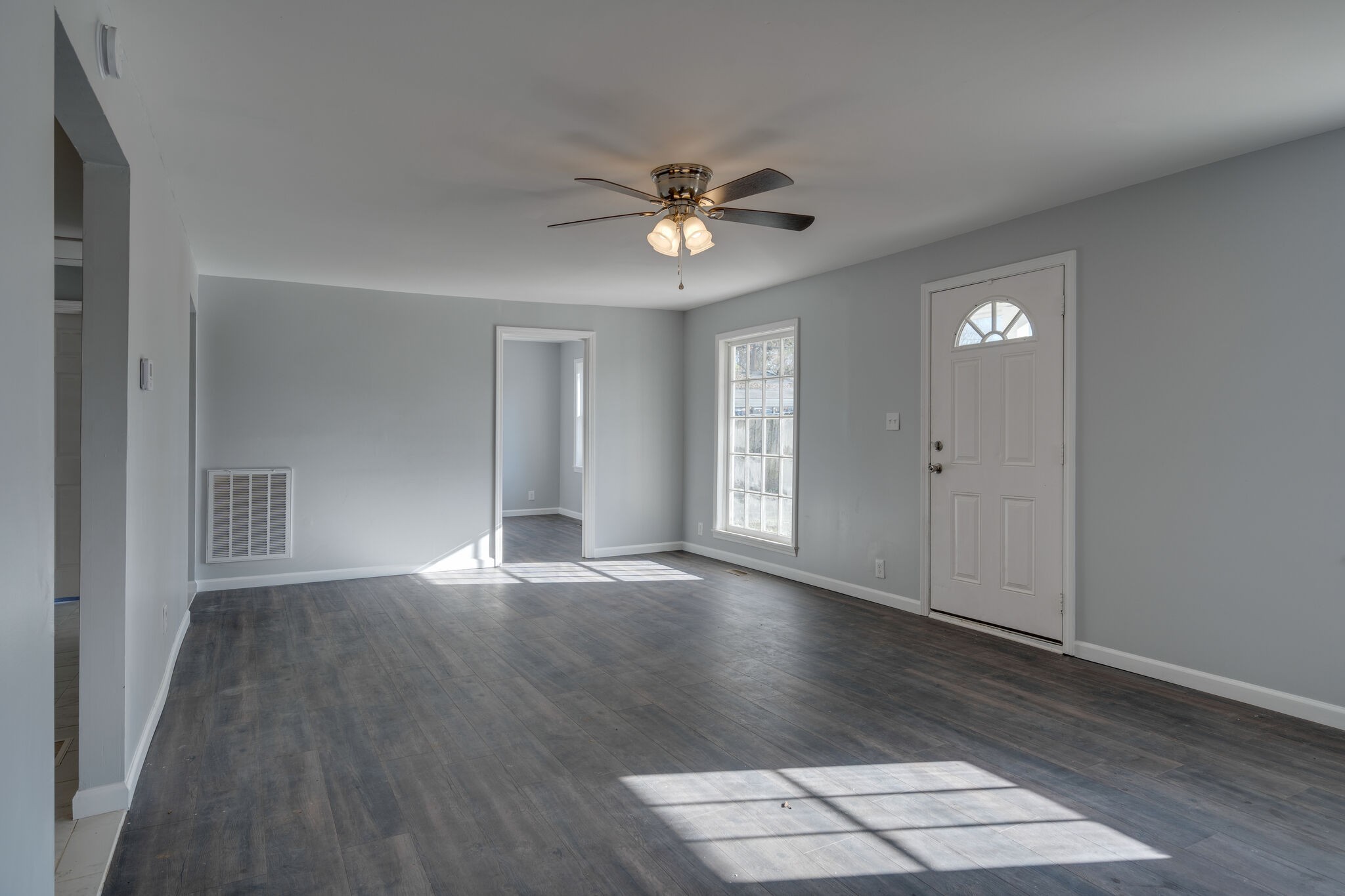 706 Pace Street Gallatin, TN 37066 - Photo 13 of 20 wooden floor in an empty room with a window