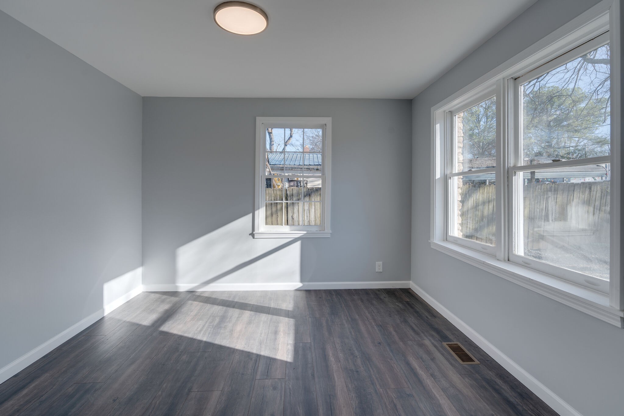 706 Pace Street Gallatin, TN 37066 - Photo 14 of 20 a view of empty room with wooden floor and fan