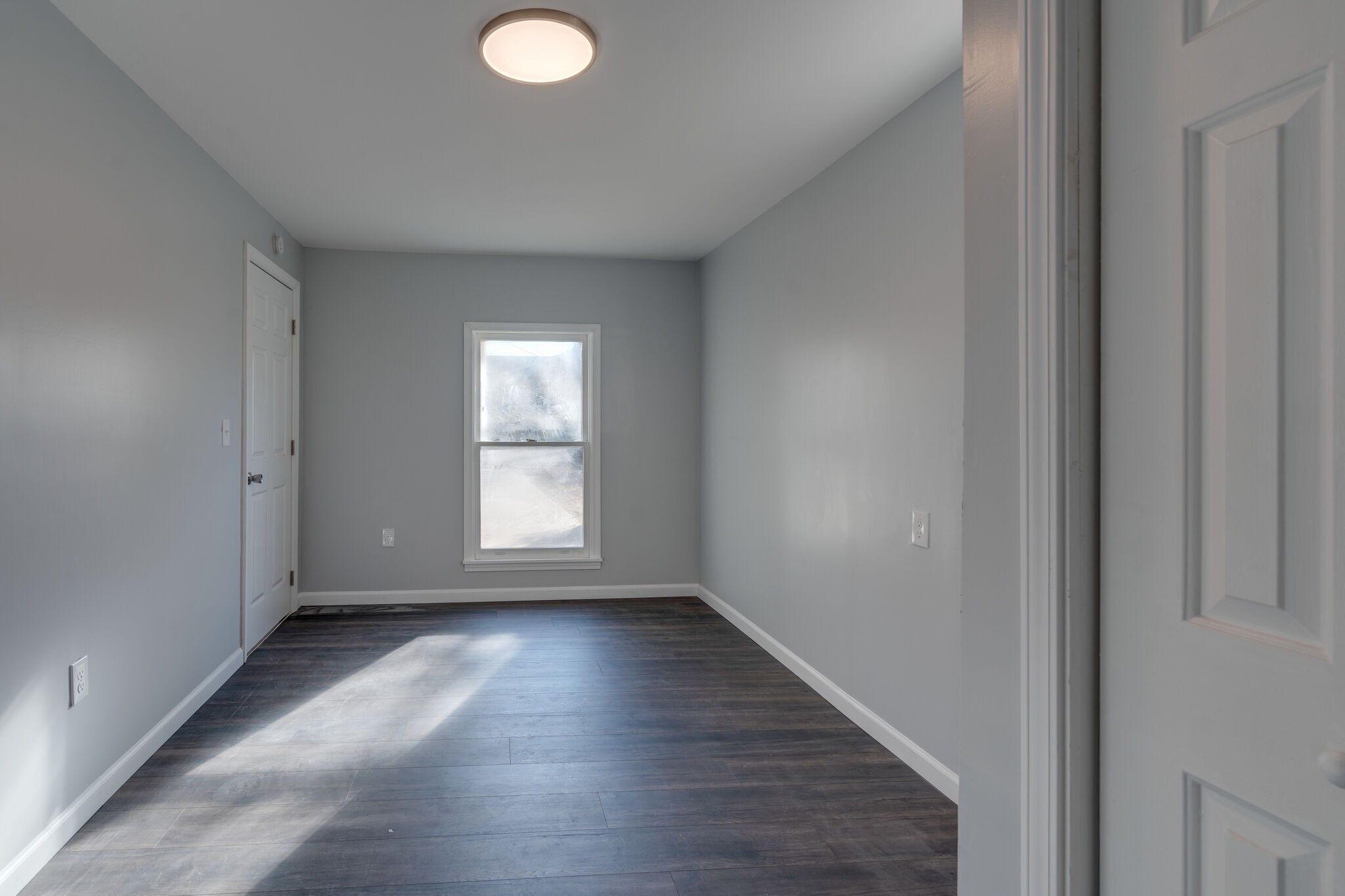 706 Pace Street Gallatin, TN 37066 - Photo 15 of 20 a view of empty room with wooden floor and fan