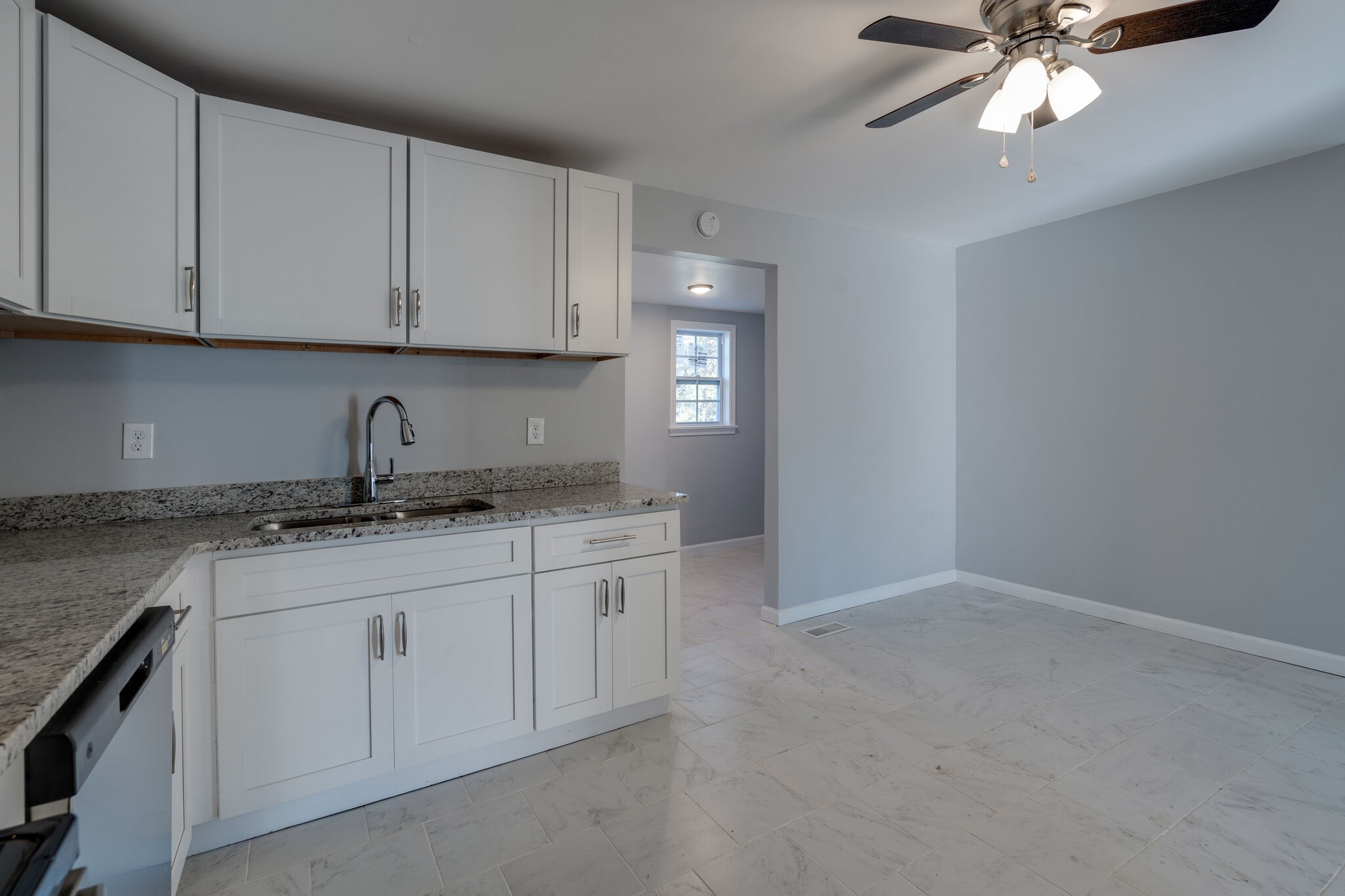 706 Pace Street Gallatin, TN 37066 - Photo 7 of 20 a kitchen with granite countertop white cabinets and a sink
