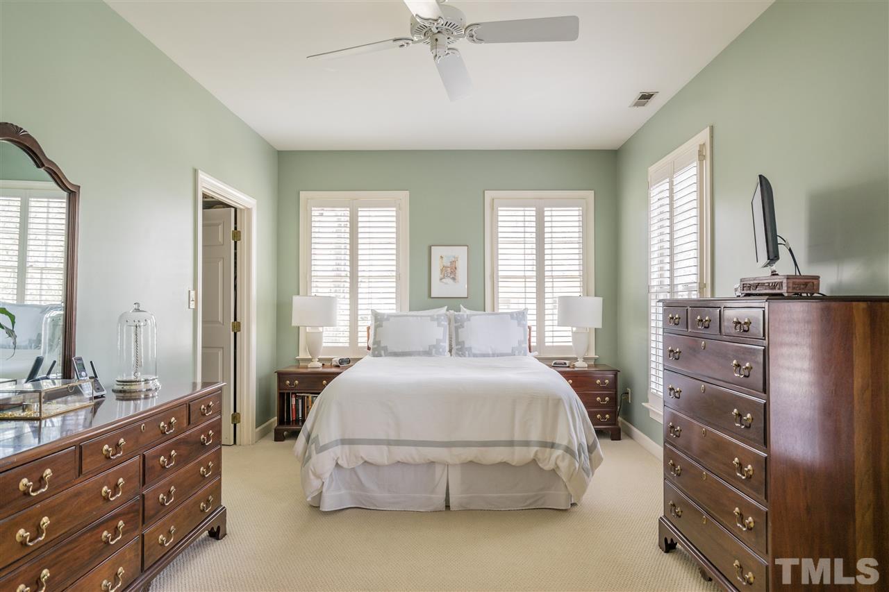 2808 Royster Street Raleigh, NC 27608 - Photo 14 of 25 a bedroom with a bed and a dresser