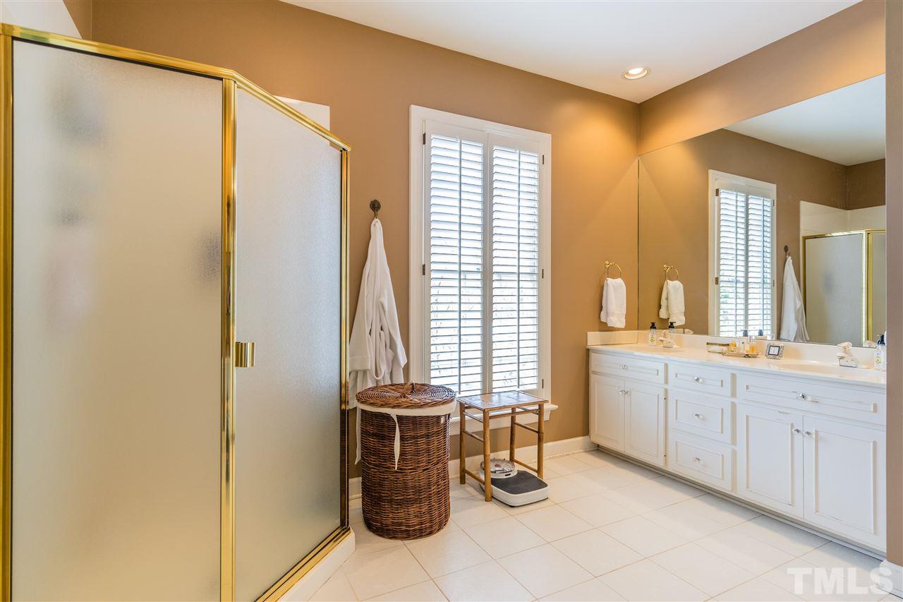 2808 Royster Street Raleigh, NC 27608 - Photo 16 of 25 a bathroom with a sink and a mirror