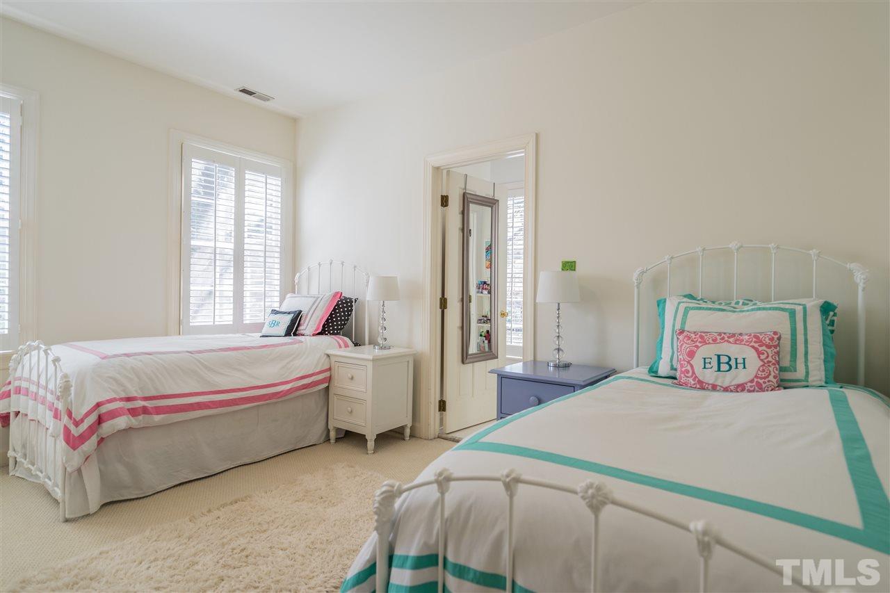2808 Royster Street Raleigh, NC 27608 - Photo 17 of 25 a bedroom with a bed and a painting on the wall