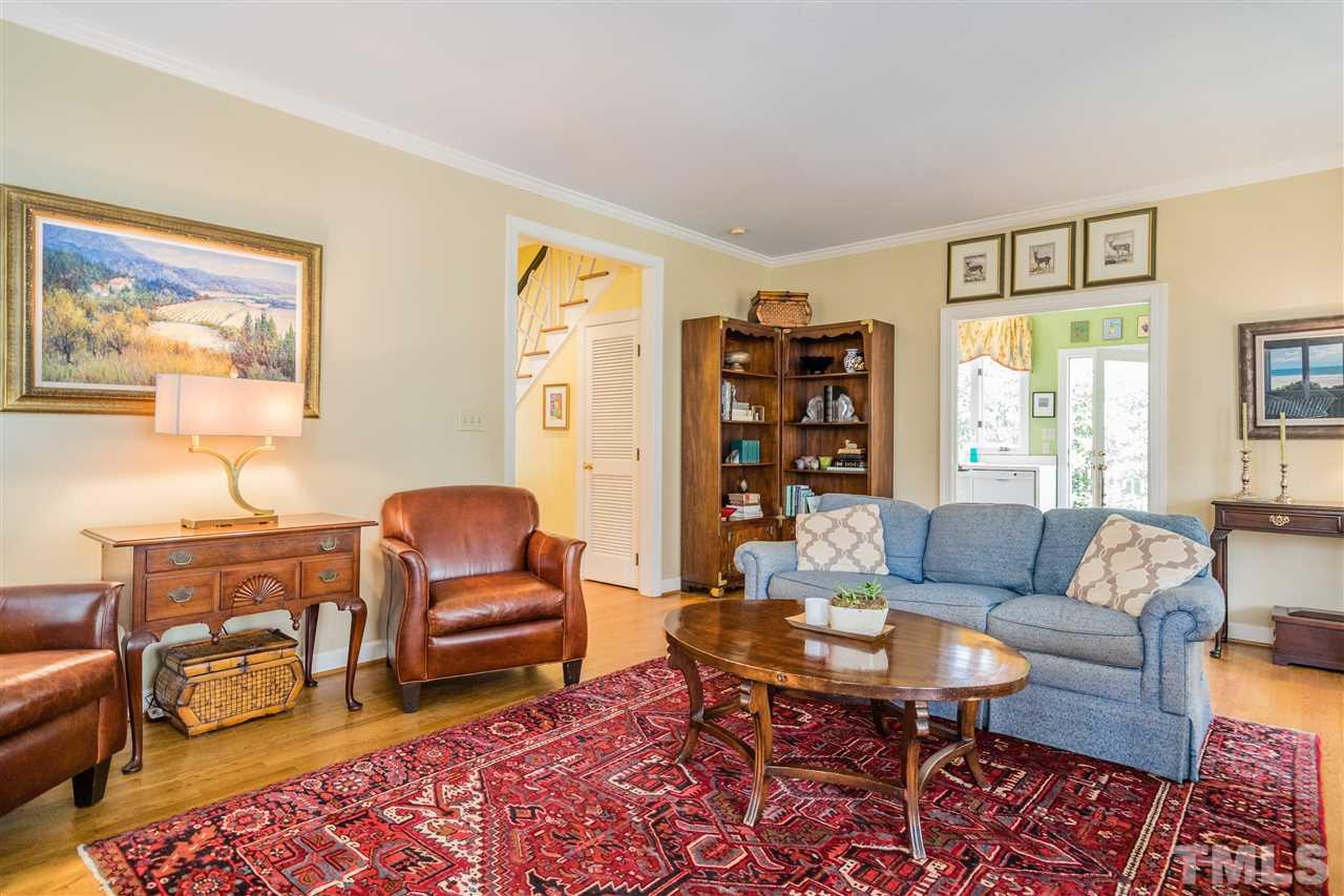 2808 Royster Street Raleigh, NC 27608 - Photo 7 of 25 a living room with fireplace furniture and a window