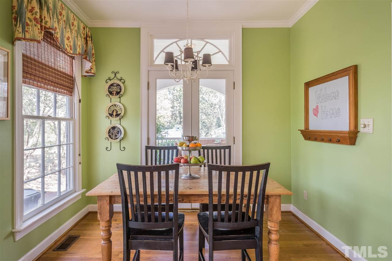 2808 Royster Street Raleigh, NC 27608 - Photo 9 of 25 a view of a dining room with furniture wooden floor and chandelier