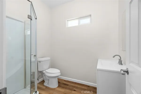 a bathroom with a toilet a sink and a shower