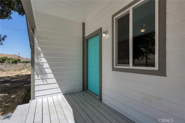 a view of balcony with wooden floor and outdoor space