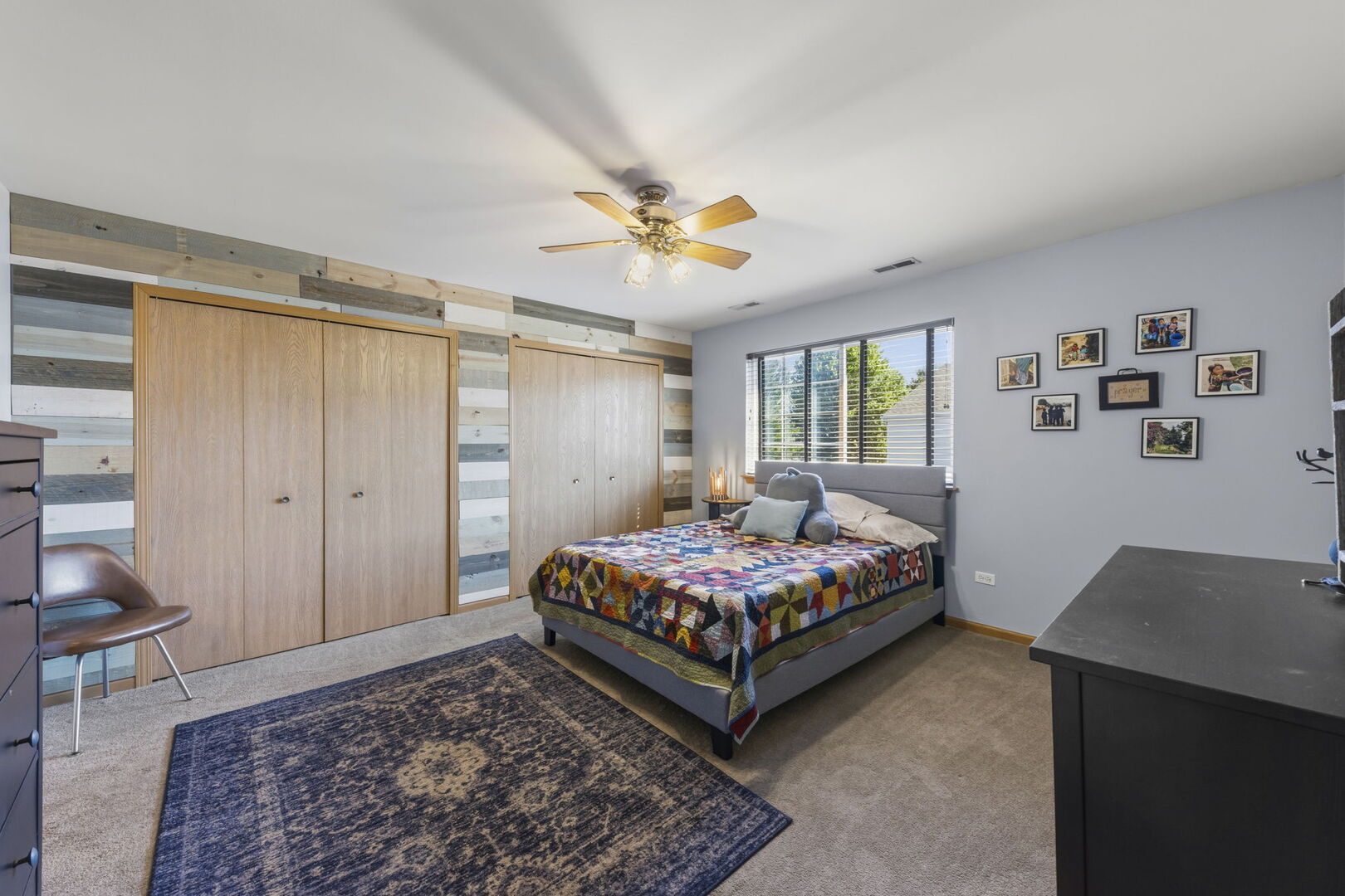965 Constance Lane, Unit G Sycamore, IL 60178 - Photo 16 of 25 a bedroom with a bed and a chandelier