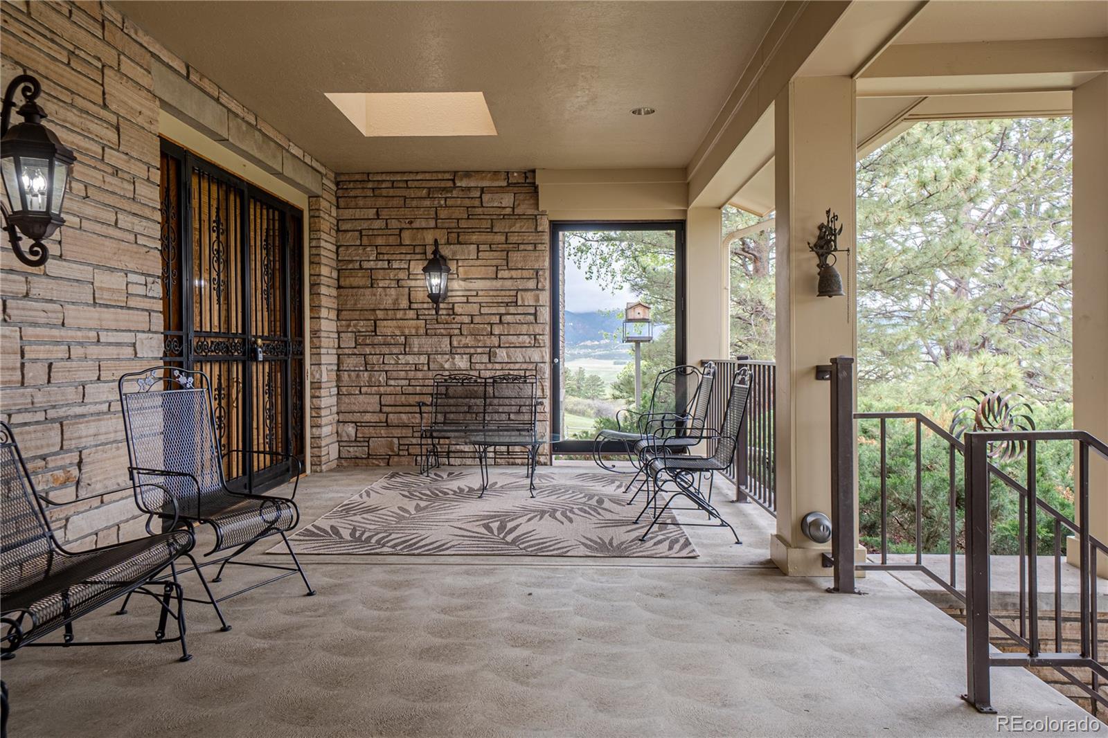 3282 Tomah Road Larkspur, CO 80118 - Photo 34 of 35 a view of front door and porch