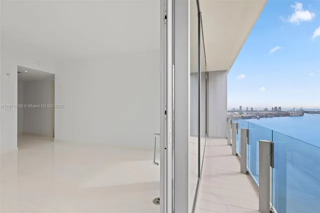 a view of a hallway with a kitchen