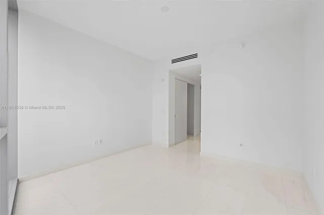 a bathroom with a shower a toilet and sink