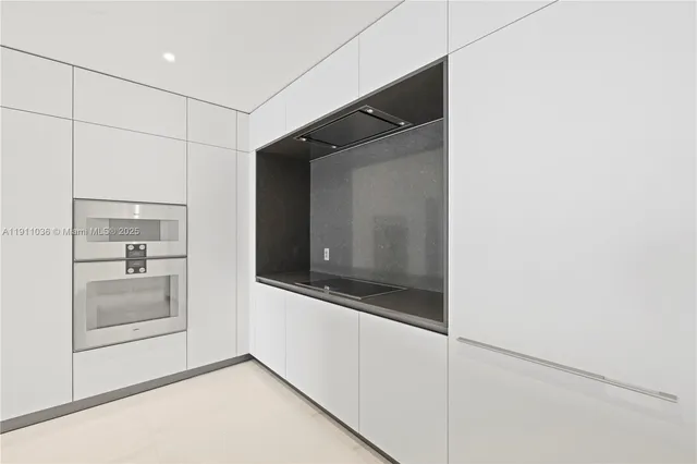 a view of hallway with cabinets