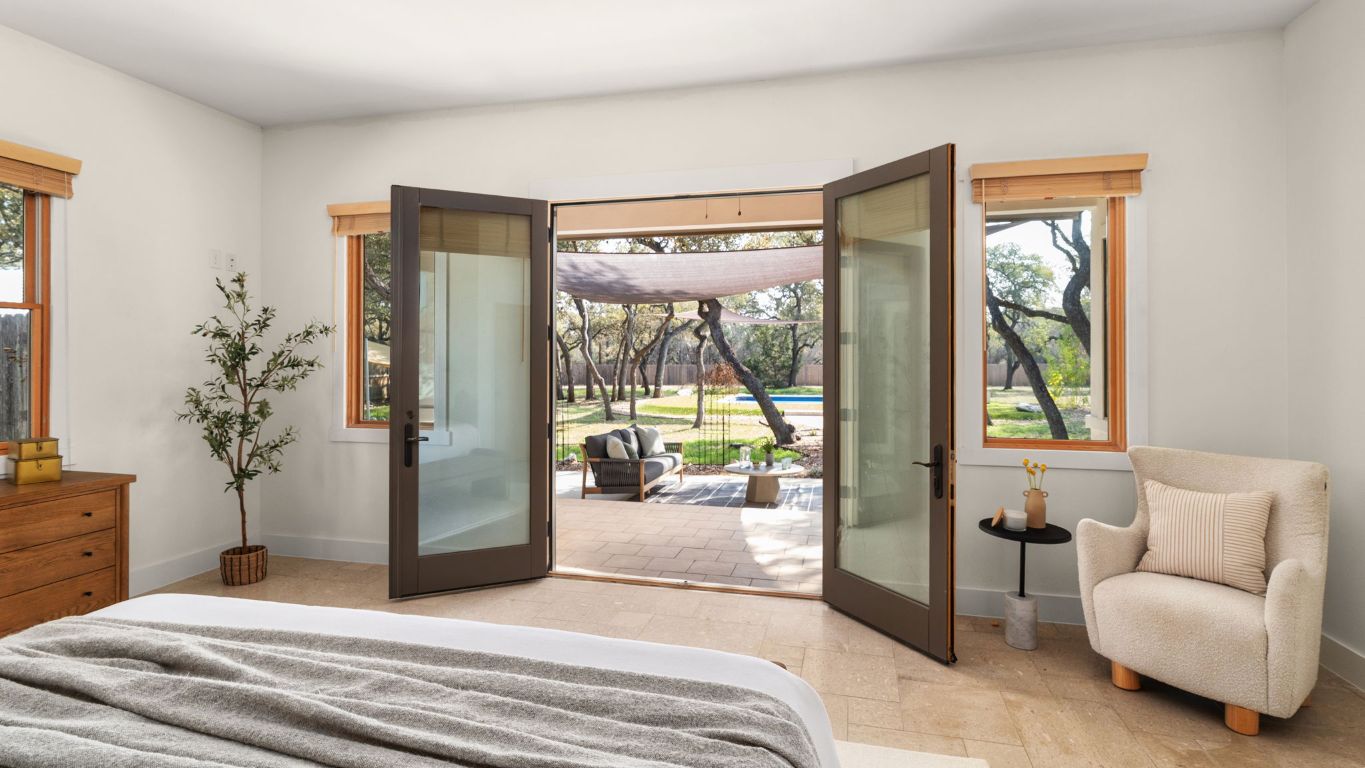 2819 Cross Road San Marcos, TX 78666 - Photo 19 of 40 French doors open out to the back patio with a gorgeous view of the pool.