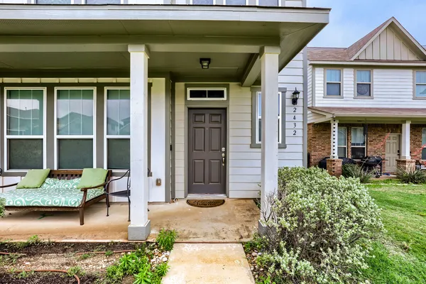 a front view of a house with garden