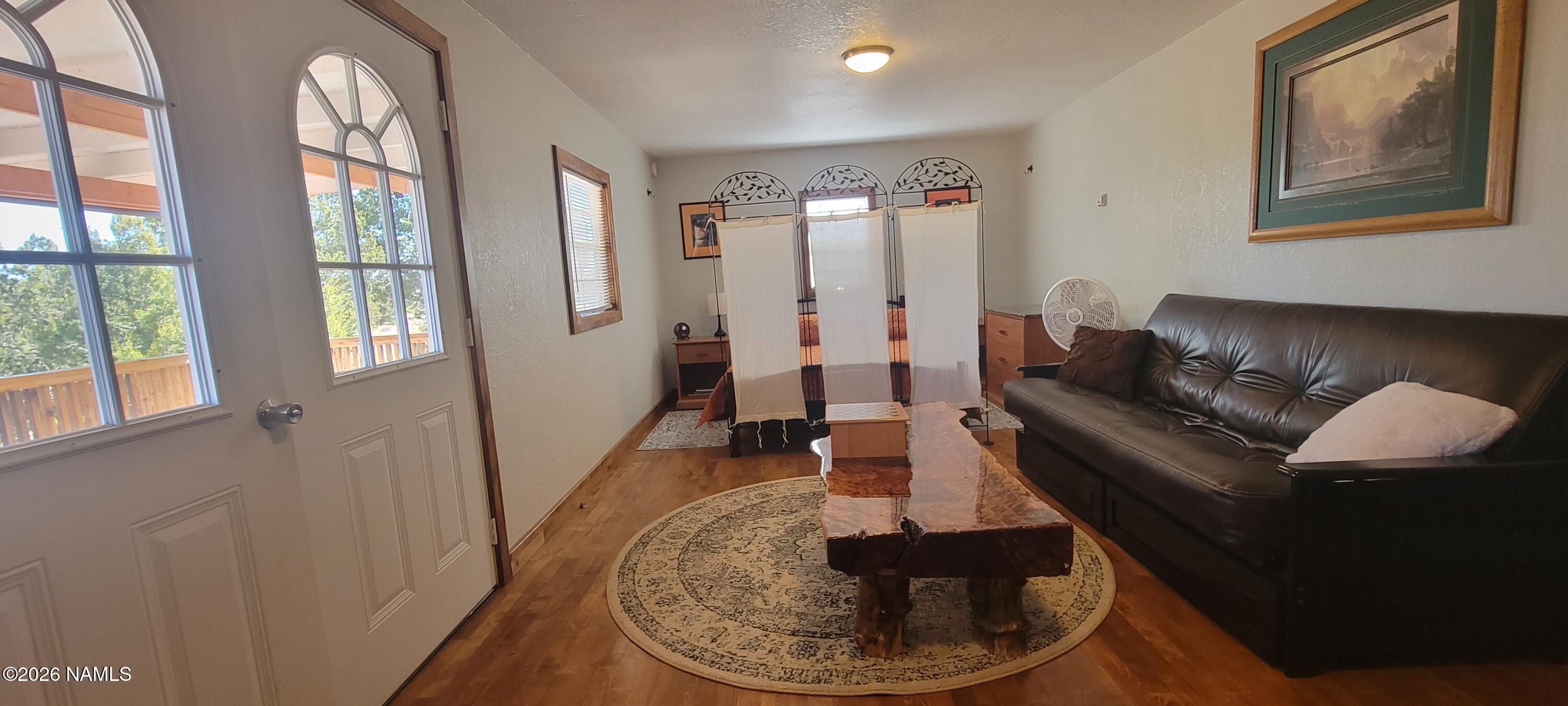 4650 Juniper Road Williams, AZ 86046 - Photo 1 of 28 a living room with furniture and a fireplace