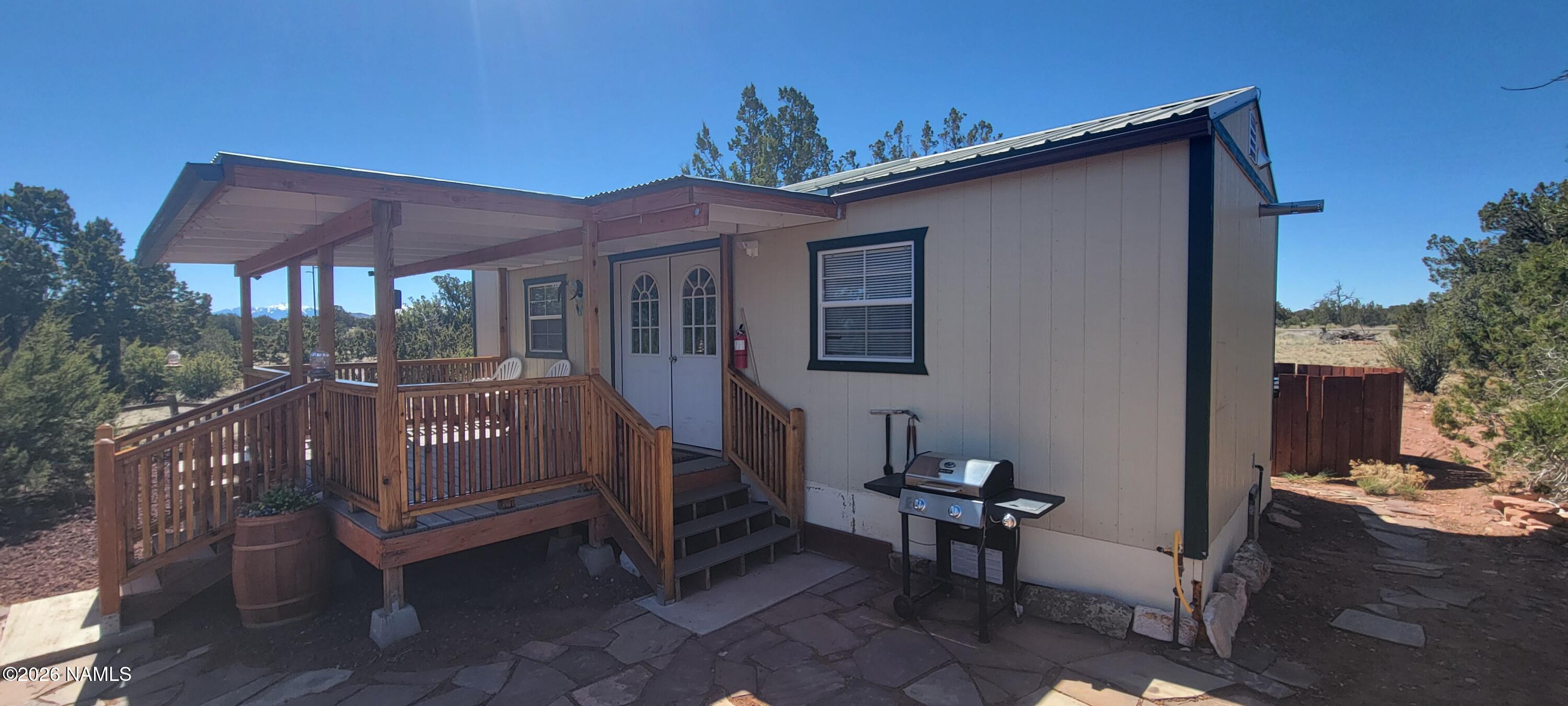 4650 Juniper Road Williams, AZ 86046 - Photo 17 of 28 a view of a house with backyard and sitting area