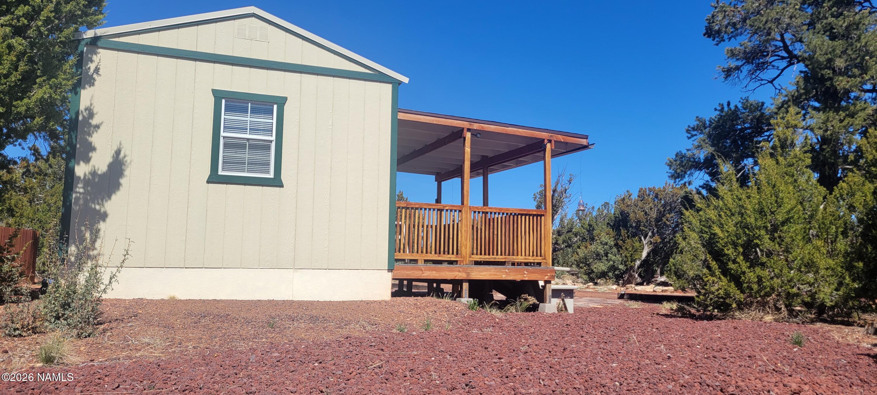 4650 Juniper Road Williams, AZ 86046 - Photo 19 of 28 a view of a house with backyard and sitting area