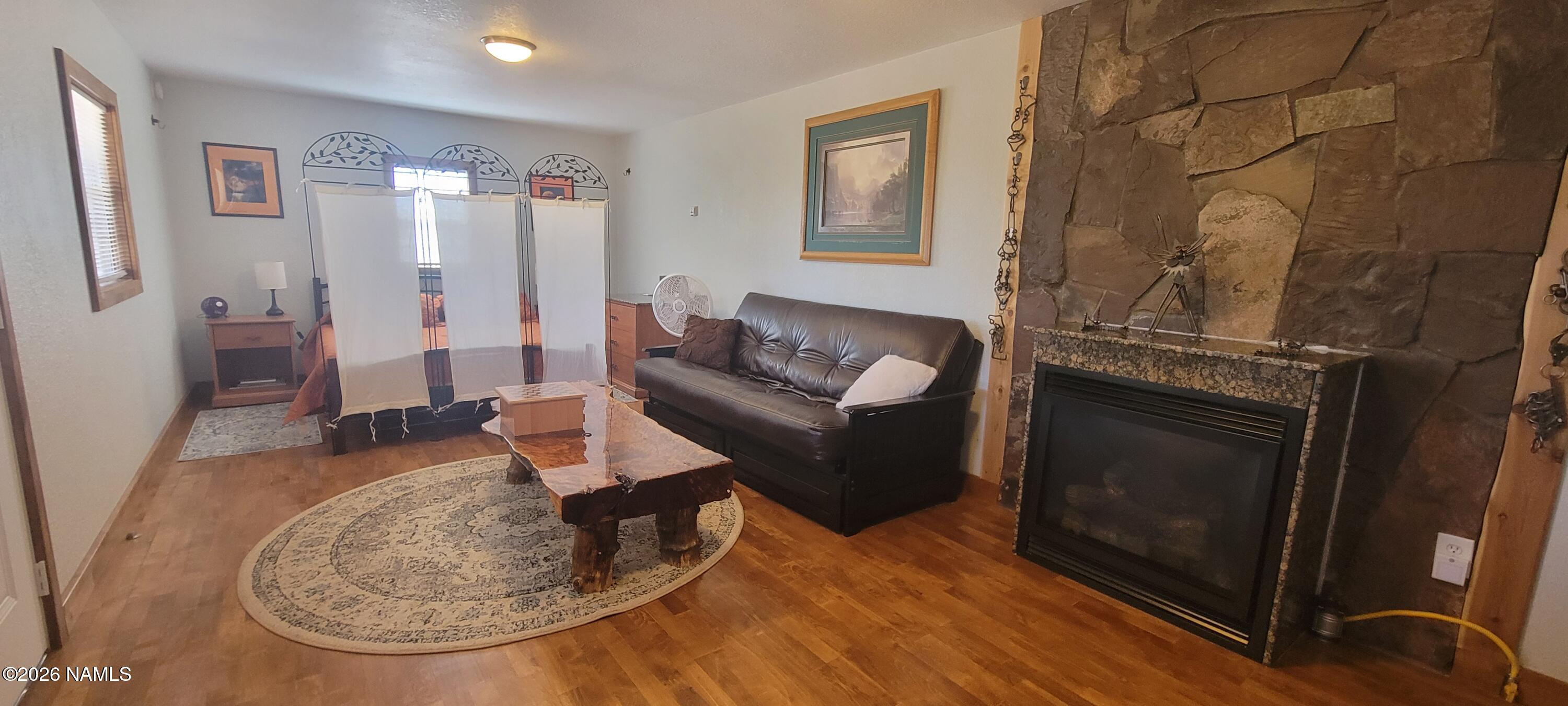 4650 Juniper Road Williams, AZ 86046 - Photo 5 of 28 a living room with furniture and a fireplace