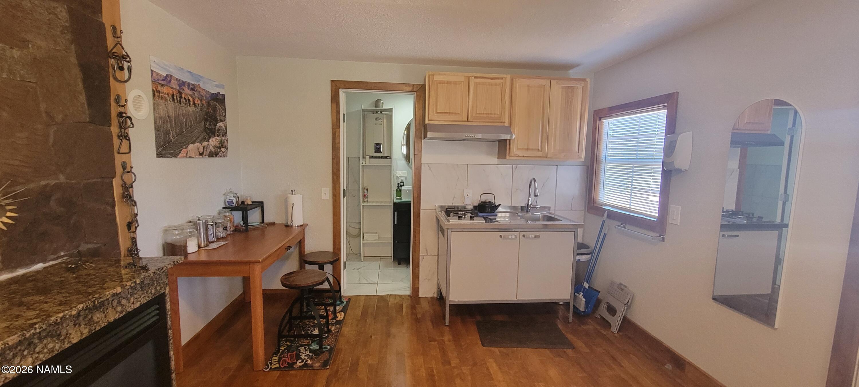 4650 Juniper Road Williams, AZ 86046 - Photo 6 of 28 a room with a refrigerator and a sink