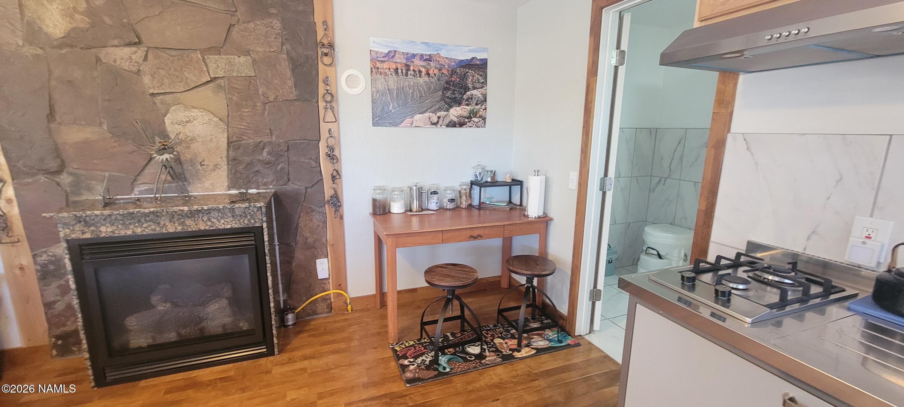 4650 Juniper Road Williams, AZ 86046 - Photo 7 of 28 a living room with furniture and a fireplace