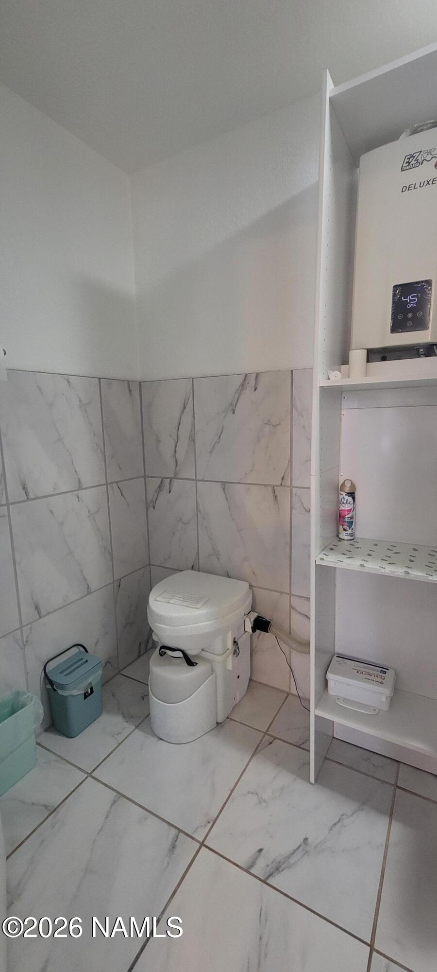 4650 Juniper Road Williams, AZ 86046 - Photo 10 of 28 a bathroom with a toilet and a sink
