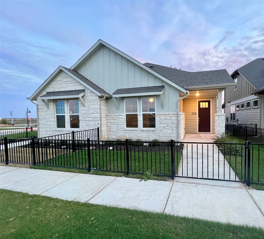 111 Pinnacle Lane, Unit B Kyle, TX 78640 - Photo 1 of 1 a front view of a house with a garden