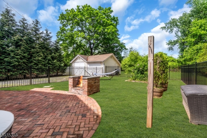 105 Somerville Road Bedminster, NJ 07921 - Photo 29 of 36 a view of a house with a backyard and a patio