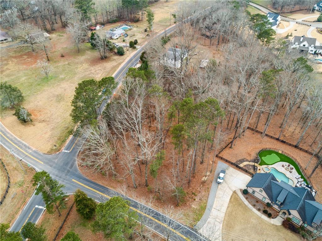 1315 Gaddis Road Canton, GA 30115 - Photo 2 of 8 a picture of trees with wooden fence