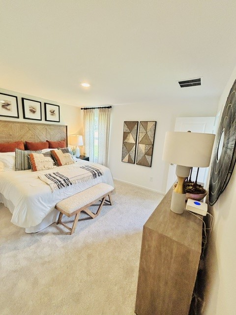 2126 Mosaic Vly Court Angleton, TX 77515 - Photo 18 of 40 a bedroom with a bed and wooden floor