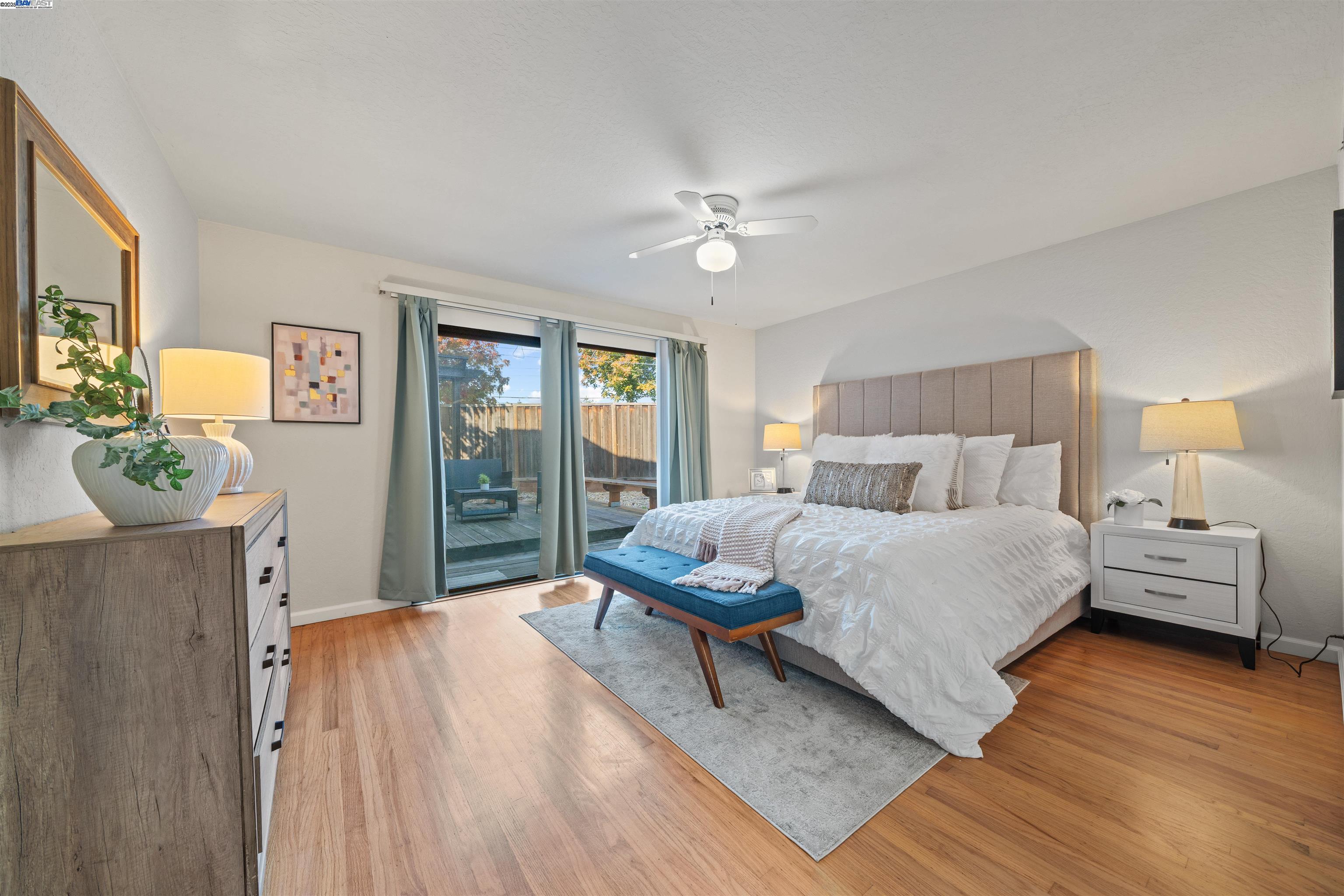 3393 Sutton Loop Fremont, CA 94536 - Photo 15 of 47 a bedroom with a bed mirror and a window