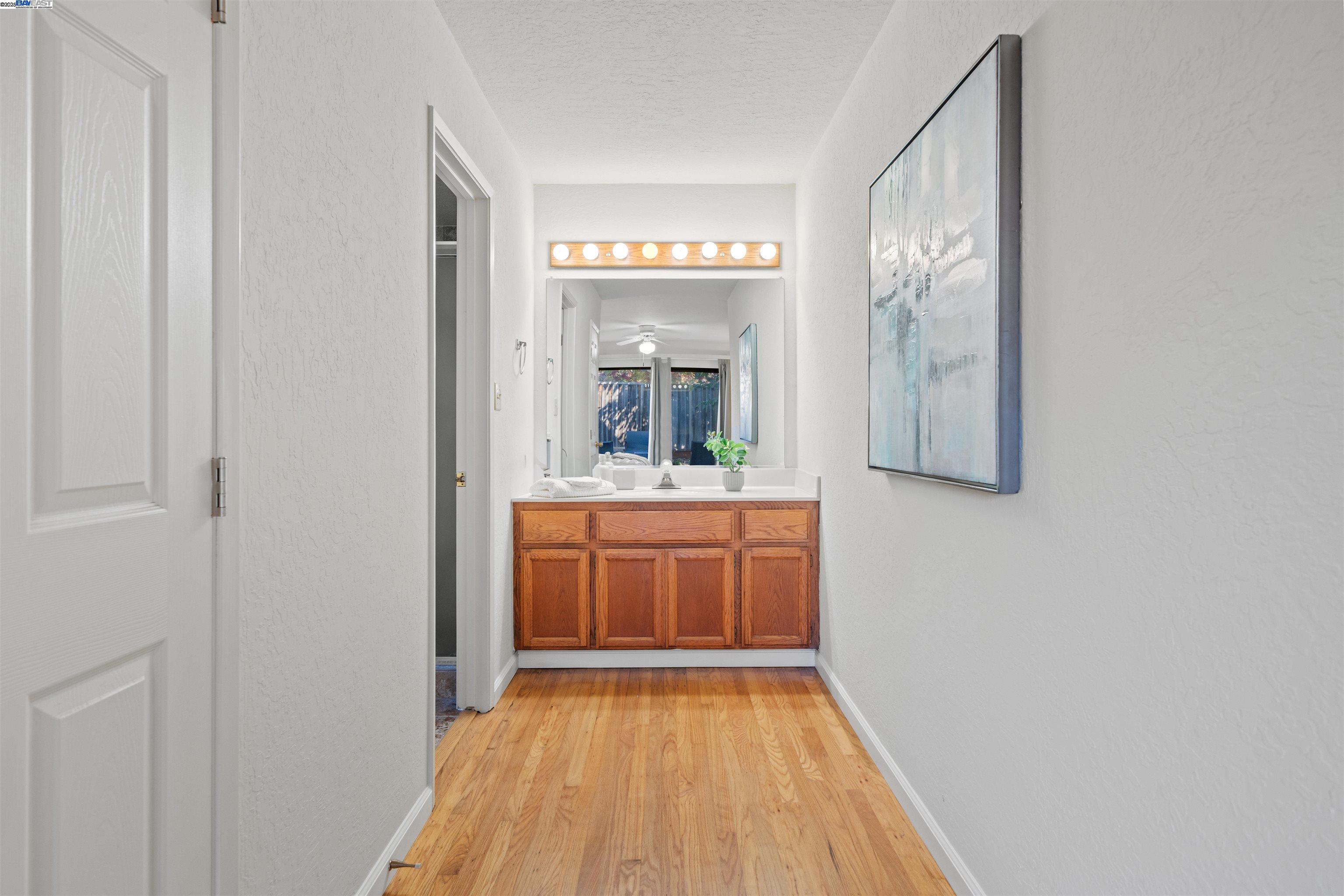 3393 Sutton Loop Fremont, CA 94536 - Photo 17 of 47 a view of a bathroom from a hallway