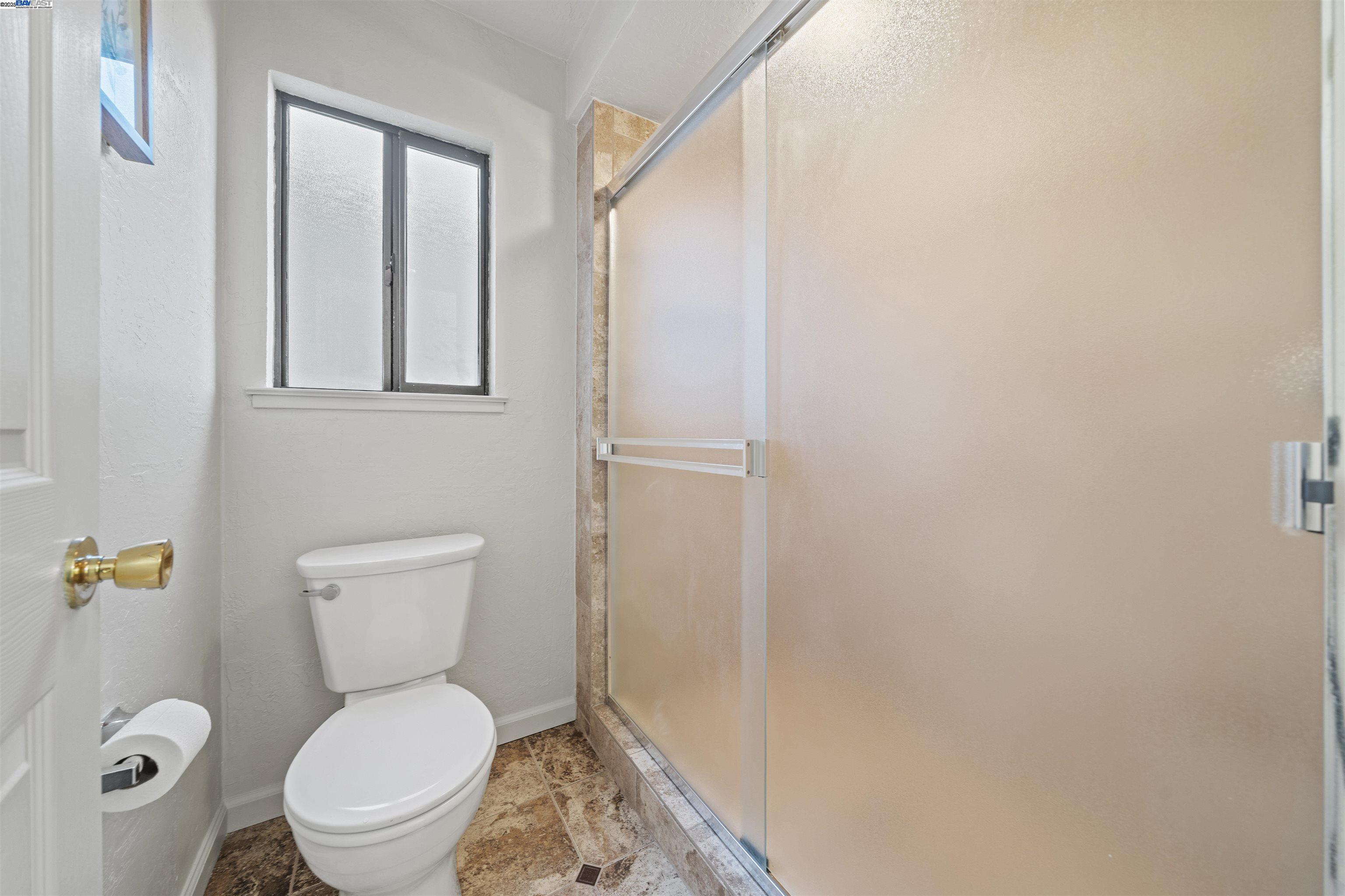 3393 Sutton Loop Fremont, CA 94536 - Photo 19 of 47 a white toilet sitting next to a bathroom sink