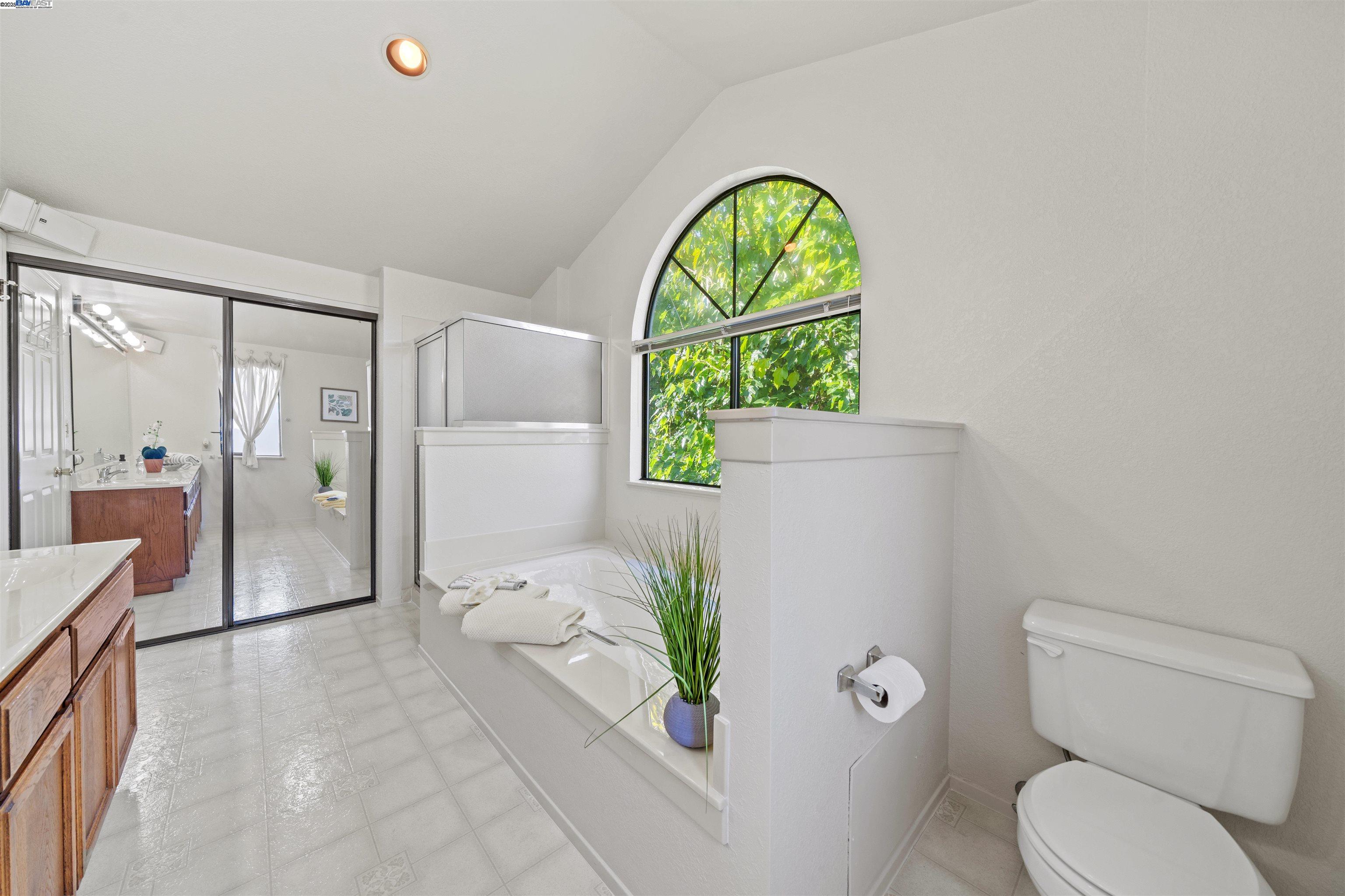 3393 Sutton Loop Fremont, CA 94536 - Photo 25 of 47 a living room with a toilet and a shower