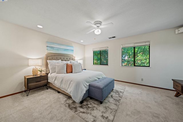 a bed room with a bed and a window