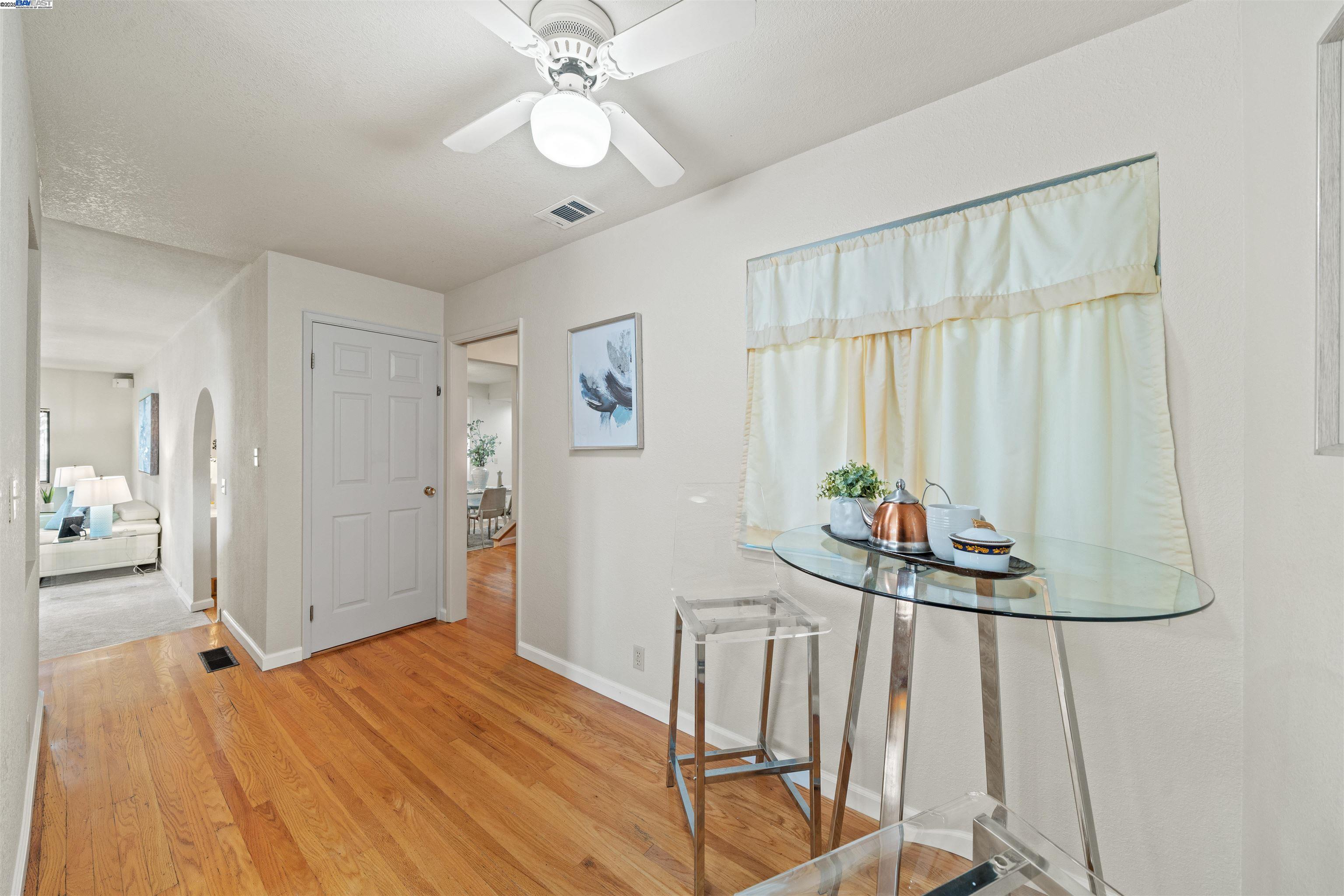 3393 Sutton Loop Fremont, CA 94536 - Photo 8 of 47 a bedroom with a bed and a chandelier