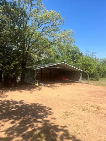 a view of a yard with a tree