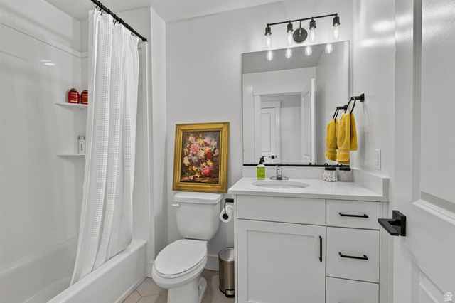 355 West 3085 South Logan, UT 84321 - Photo 29 of 40 White vanity with a quartz countertop, integrated sink, and black hardware