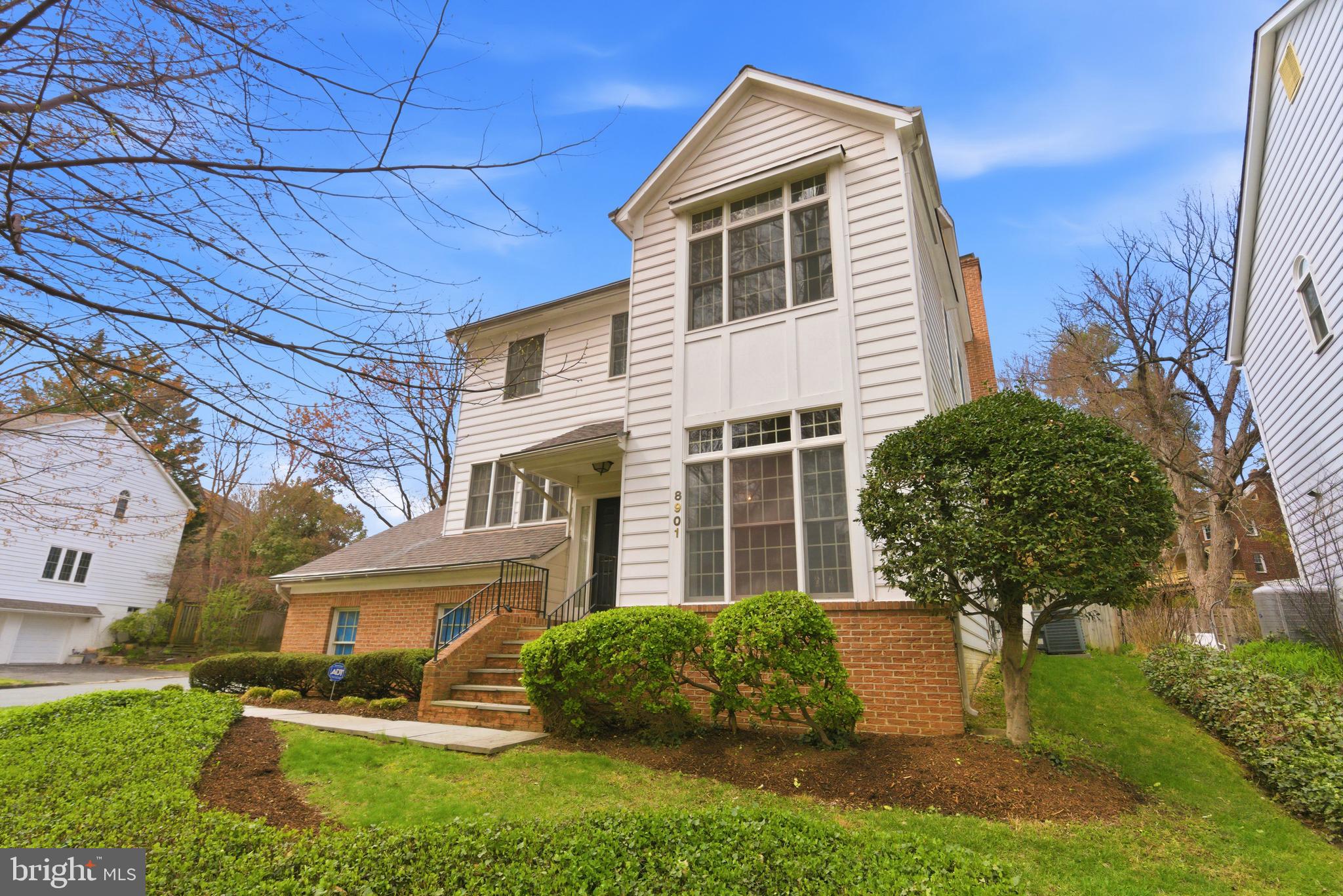 8901 Ellsworth Court Silver Spring, MD 20910 - Photo 39 of 43 a front view of a house with garden