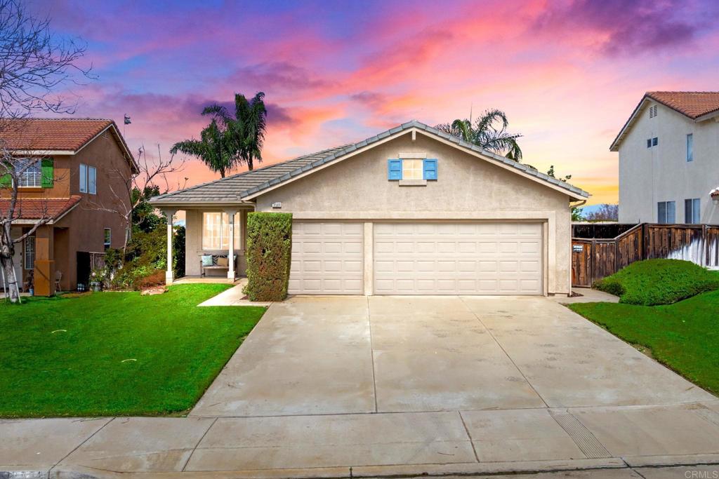 19584 Rotterdam Street Riverside, CA 92508 - Photo 1 of 1 a view of backyard of house with green space