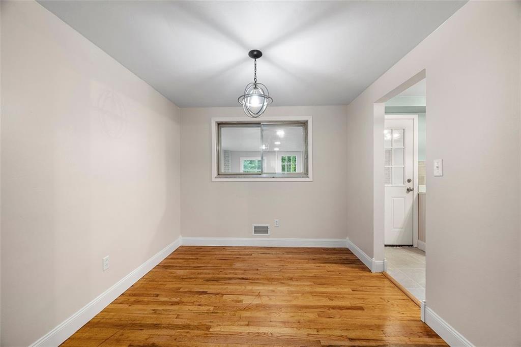1015 Fiddleback Drive McKees Rocks, PA 15136 - Photo 11 of 43 a view of empty room with wooden floor and fan