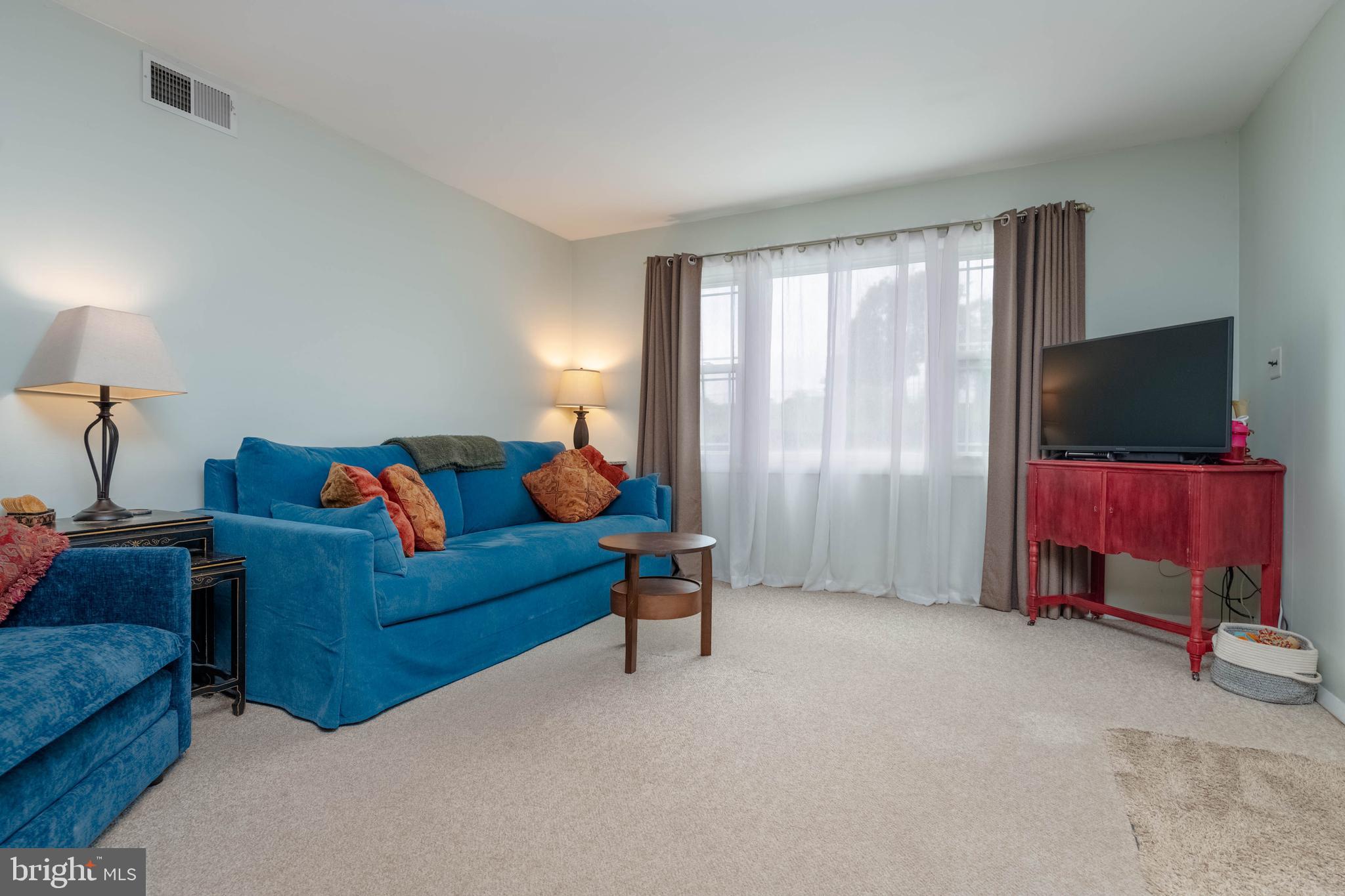 8600 Saddler Road Parkville, MD 21234 - Photo 15 of 39 a living room with furniture and a flat screen tv