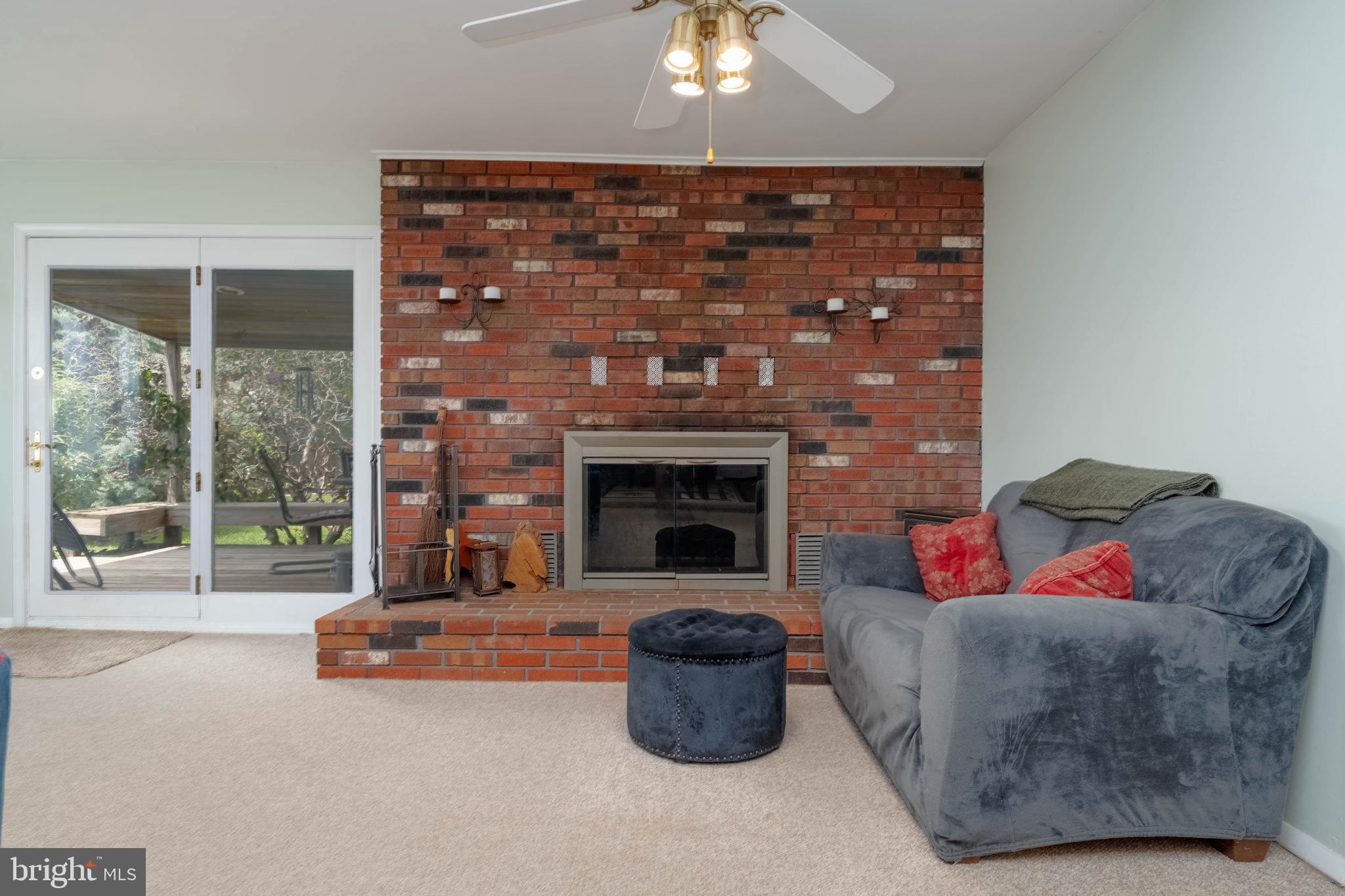 8600 Saddler Road Parkville, MD 21234 - Photo 16 of 39 a living room with furniture and a fireplace