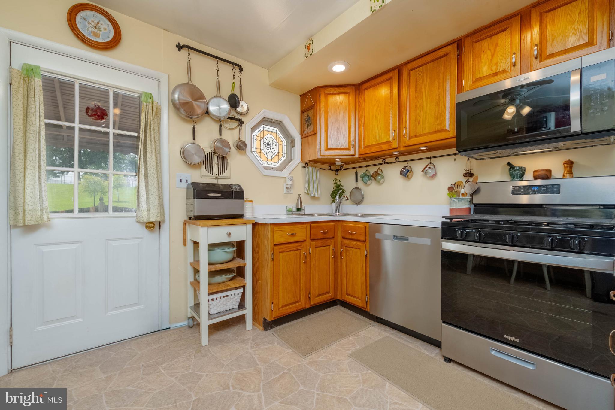 8600 Saddler Road Parkville, MD 21234 - Photo 20 of 39 a kitchen with stainless steel appliances granite countertop a stove and a sink