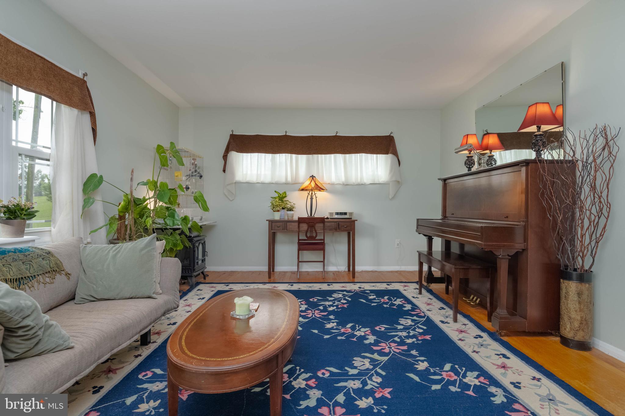 8600 Saddler Road Parkville, MD 21234 - Photo 2 of 39 a living room with furniture and a fireplace