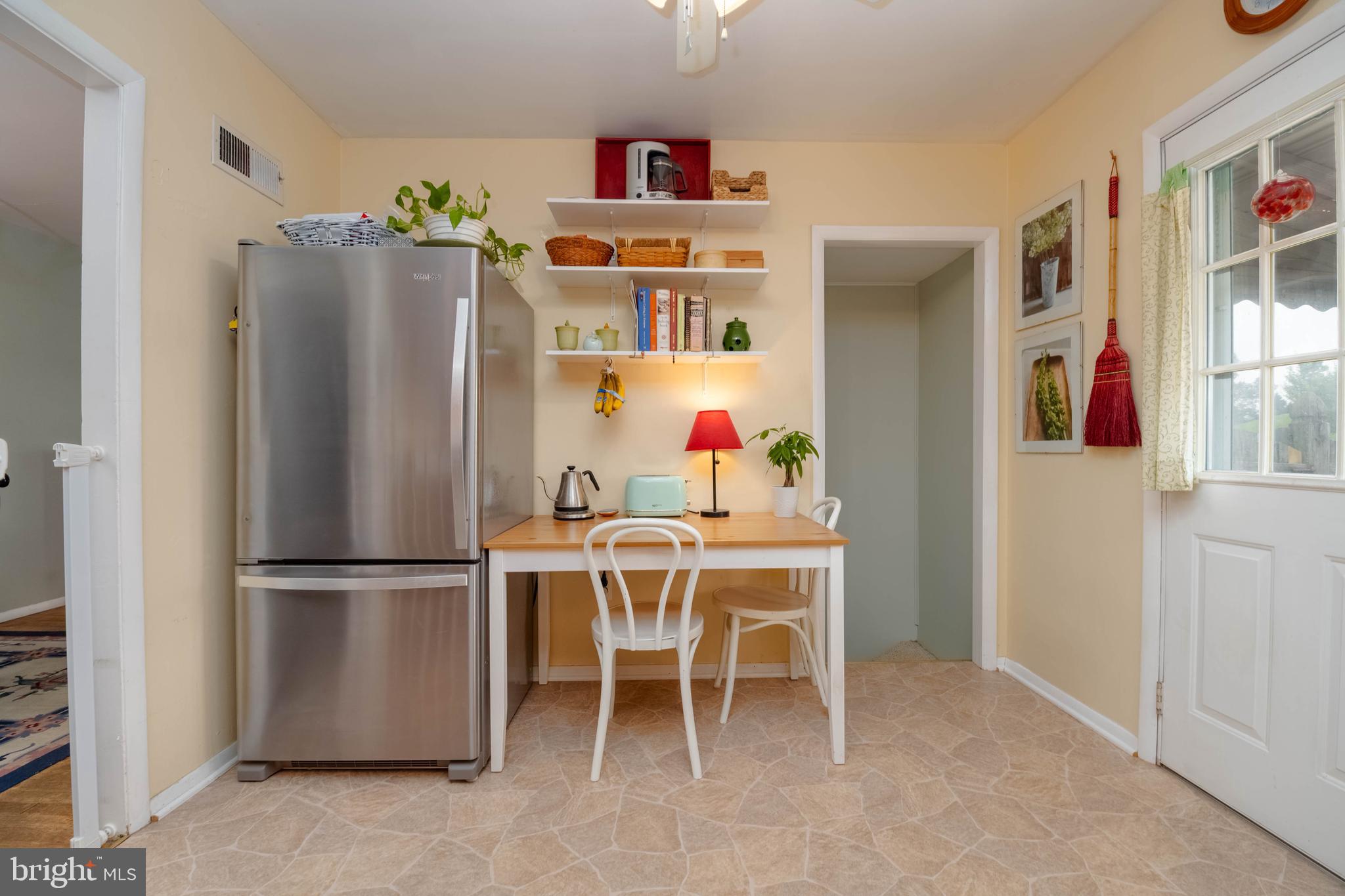 8600 Saddler Road Parkville, MD 21234 - Photo 21 of 39 a kitchen with stainless steel appliances granite countertop a refrigerator and a dining table